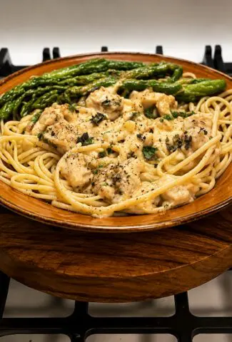 Butter Poached Lobster Tails in Garlic, Caper, Sauce over Fettuccine