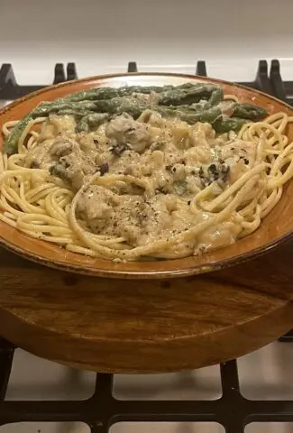 Butter Poached Lobster Tails in Garlic, Caper, Sauce over Fettuccine